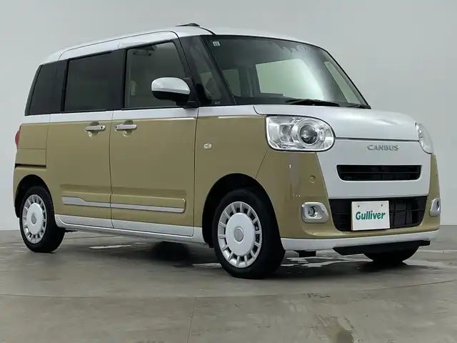 ダイハツ ムーヴ キャンバス ストライプス G 鹿児島県 2024(令6)年 1万km シャイニングホワイトパール/サンドベージュメタリック 純正9インチディスプレイオーディオ/（フルセグ/BT/HDMI/USB）/パノラミックビューモニター/スマートアシスト/レーンキープアシスト/両側パワースライドドア/前席シートヒーター/ホッとカップホルダー/オートライト/LEDヘットライト/プッシュスタート/アイドリングストップ/ワイヤレス充電機能/フロアマット/スマートキー