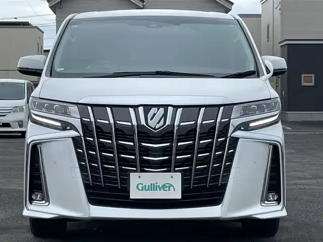 トヨタ アルファード SC 道央・札幌 2019(令1)年 3.1万km ホワイトパールクリスタルシャイン ４WD/ワンオーナー/社外メモリーナビ/CD/DVD/BT/フルセグ/社外フリップダウンモニター/トヨタセーフティセンス/プリクラッシュセーフティ/横滑り防止装置/レーダークルーズコントロール/レーンキープアシスト/クリアランスソナー/パーキングサポートブレーキ/ロードサインアシスト/バックカメラ/ビルトインETC/ドライブレコーダー/アイドリングストップ/ECOMODE/両側パワースライドドア/パワーバックドア/前席/２列目パワーシート/前席/２列目シートヒーター/前席エアシート/N席/２列目オットマン/レザーシート/革巻きウッドコンビステアリング/ステアリングリモコン/AC100V/自動防眩ミラー/電動パーキング/ブレーキホールド/MTモード付AT/プッシュスタート/スマートキー/LEDヘッドライト/オートライト/オートハイビーム/フォグランプ/電動格納ミラー/ウィンカーミラー/純正フロアマット