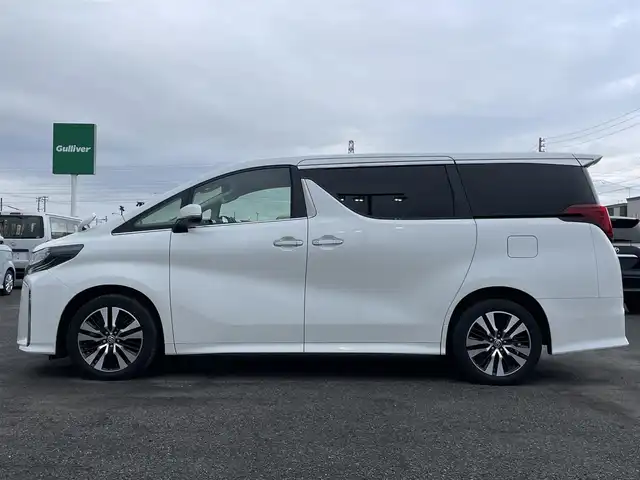 トヨタ アルファード SC 道央・札幌 2019(令1)年 3.1万km ホワイトパールクリスタルシャイン ４WD/ワンオーナー/社外メモリーナビ/CD/DVD/BT/フルセグ/社外フリップダウンモニター/トヨタセーフティセンス/プリクラッシュセーフティ/横滑り防止装置/レーダークルーズコントロール/レーンキープアシスト/クリアランスソナー/パーキングサポートブレーキ/ロードサインアシスト/バックカメラ/ビルトインETC/ドライブレコーダー/アイドリングストップ/ECOMODE/両側パワースライドドア/パワーバックドア/前席/２列目パワーシート/前席/２列目シートヒーター/前席エアシート/N席/２列目オットマン/レザーシート/革巻きウッドコンビステアリング/ステアリングリモコン/AC100V/自動防眩ミラー/電動パーキング/ブレーキホールド/MTモード付AT/プッシュスタート/スマートキー/LEDヘッドライト/オートライト/オートハイビーム/フォグランプ/電動格納ミラー/ウィンカーミラー/純正フロアマット