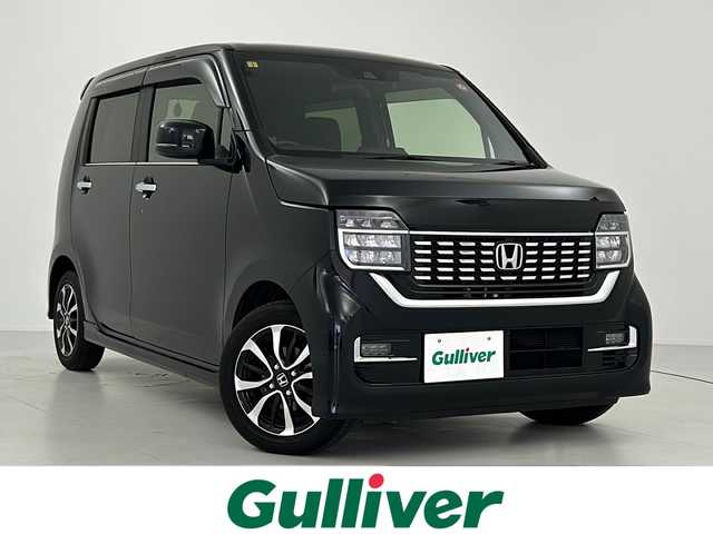 ホンダ Ｎ ＷＧＮ カスタム L ホンダセンシング 大阪府 2021(令3)年 1.1万km クリスタルブラックパール HondaSENSING/・衝突軽減ブレーキ/・渋滞追従機能付ACC/・パーキングセンサーシステム/・誤発進抑制機能/・後方誤発進抑制機能/・歩行者事故低減ステアリング/・先行車発進お知らせ機能/・標識認識機能/・路外逸脱抑制機能/・LKAS/純正SDナビ【VXU-217NBi】/(フルセグ/CD/SD/Bluetooth)/LEDヘッドライト/フォグランプ/ヘッドライトレベライザー/バックカメラ/ビルトインETC/シートヒーター/アイドリングストップ/純正14インチAW/電格ミラー/ウインカーミラー/純正フロアマット/スマートキー