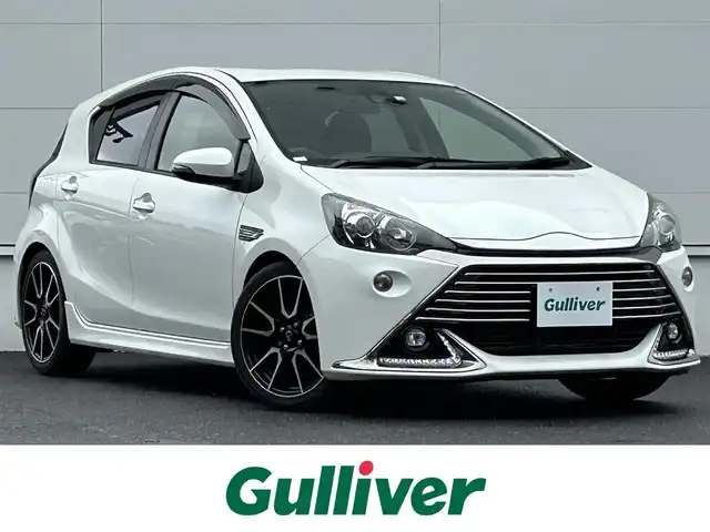 トヨタ アクア G G’s 佐賀県 2016(平28)年 3.2万km ライムホワイトパールクリスタルシャイン トヨタセーフティセンス/・プリクラッシュセーフティ/・レーンディパーチャーアラート/・オートマチックハイビーム/クルーズコントロール/社外ナビ/・バックカメラ/・フルセグTV/BT/CD/DVD/G’z専用17インチAW/G’z専用ハーフレザーシート/前席シートヒーター/LEDヘッドライト/オートライト/フォグランプ/ETC/プッシュスタート/ステアリングスイッチ/ISOFIX/スペアキー×１