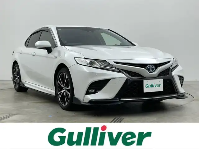 トヨタ カムリ WSレザーパッケージ 岡山県 2019(令1)年 6.1万km プラチナホワイトパールマイカ TOM’Sエアロ（前・横・後下）/レザーシート/ブラインドスポットモニター/純正8インチナビ/　「CD/DVD/フルセグTV/BT/USB」/純正ダブルツィーター/バックカメラ/追従型クルーズコントロール/オートハイビーム/LEDヘッドライト（AUTO機能付き）/ビルトインETC/前席シートヒータ/前席パワーシート/衝突軽減ブレーキシステム/車線逸脱防止システム/横滑り防止装置/純正ドライブレコーダー（前）/純正18インチアルミホイール/純正フロアマット/ステアリングヒーター/スマートキー/プッシュスタート/ヘッドアップディスプレイ/パドルシフト/バイザー