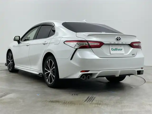 トヨタ カムリ WSレザーパッケージ 岡山県 2019(令1)年 6.1万km プラチナホワイトパールマイカ TOM’Sエアロ（前・横・後下）/レザーシート/ブラインドスポットモニター/純正8インチナビ/　「CD/DVD/フルセグTV/BT/USB」/純正ダブルツィーター/バックカメラ/追従型クルーズコントロール/オートハイビーム/LEDヘッドライト（AUTO機能付き）/ビルトインETC/前席シートヒータ/前席パワーシート/衝突軽減ブレーキシステム/車線逸脱防止システム/横滑り防止装置/純正ドライブレコーダー（前）/純正18インチアルミホイール/純正フロアマット/ステアリングヒーター/スマートキー/プッシュスタート/ヘッドアップディスプレイ/パドルシフト/バイザー