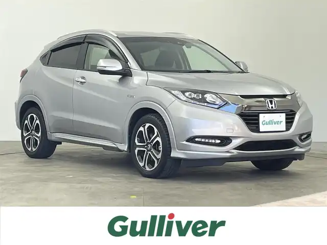 ホンダ ヴェゼル ハイブリッド Z ホンダセンシング 千葉県 2017(平29)年 2.7万km ルナシルバーM 禁煙車/ホンダセンシング/・衝突軽減ブレーキ/・歩行者事故低減ステアリング/・アダプティブ・クルーズ・コントロール/・車線維持支援システム/・路外逸脱抑制機能/・誤発進抑制機能/・先行車発進お知らせ機能/・標識認識機能/純正7インチナビ/CD/Bluetooth/フルセグ/バックカメラ/レーダークルーズコントロール/LEDオートライト/ハーフレザーシート/シートヒーター/純正17インチアルミホイール/ルーフレール/プッシュスタート/スマートキー