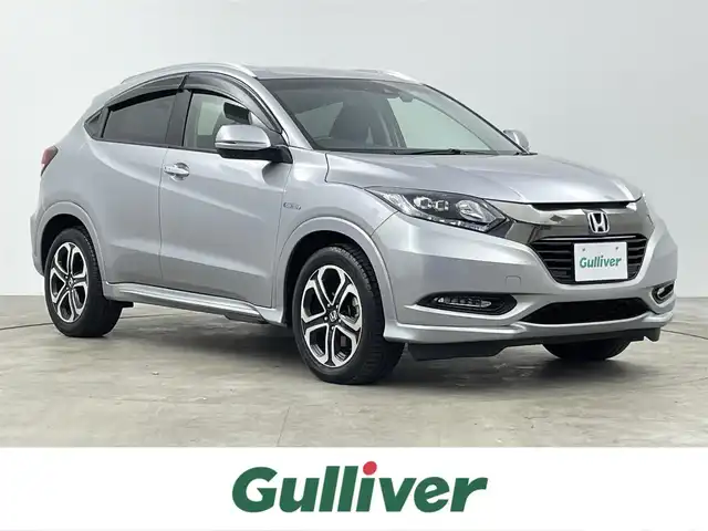 ホンダ ヴェゼル ハイブリッド Z ホンダセンシング 千葉県 2017(平29)年 2.7万km ルナシルバーM 禁煙車/ホンダセンシング/・衝突軽減ブレーキ/・歩行者事故低減ステアリング/・アダプティブ・クルーズ・コントロール/・車線維持支援システム/・路外逸脱抑制機能/・誤発進抑制機能/・先行車発進お知らせ機能/・標識認識機能/純正7インチナビ/CD/Bluetooth/フルセグ/バックカメラ/レーダークルーズコントロール/LEDオートライト/ハーフレザーシート/シートヒーター/純正17インチアルミホイール/ルーフレール/プッシュスタート/スマートキー