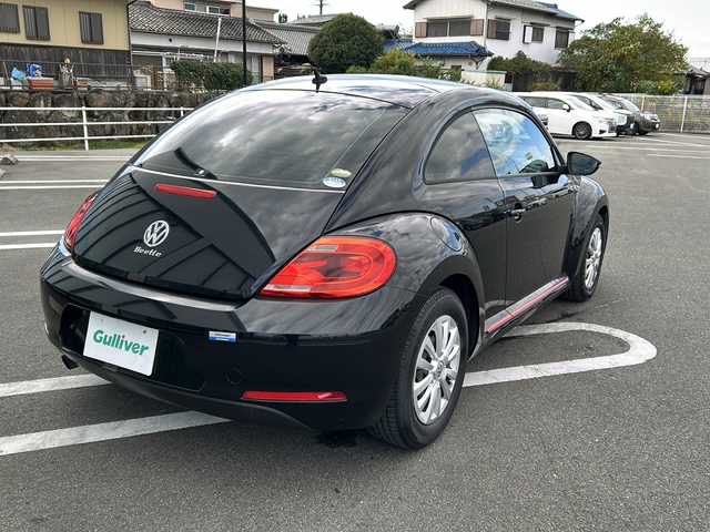 フォルクスワーゲン ザ・ビートル デザイン 岐阜県 2015(平27)年 14.4万km 黒 登録時走行距離143883km/純正ナビ/バックカメラ/フルセグTV/ターボ/Blue tooth/ETC/LEDヘッドライト/社外フロアマット/スマートキー/プッシュスタート/スペアキー/純正ホイールキャップ/エアバッグ/ABS