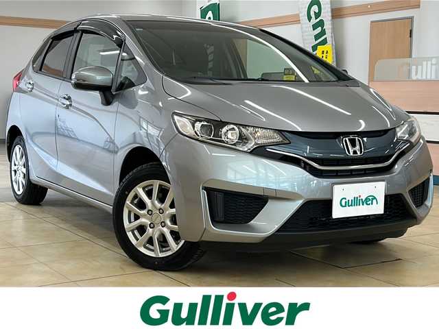 ホンダ フィット 13G Lパッケージ 道央・札幌 2014(平26)年 6.2万km ティンテッドシルバーM ・4WD/・純正ナビ/CD/SD/・バックカメラ/・純正エンジンスターター/・アイドリングストップ/・横滑り防止/・ワイパーデアイサー/・LEDヘッドライト/・プッシュスタート/・スマートキー/・ドアバイザー/・電格ミラー/・ミラーヒーター/・冬タイヤ15インチホイル積込