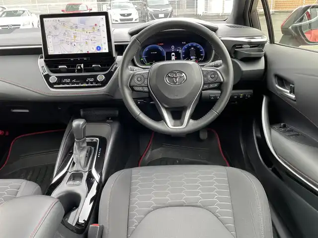 トヨタ カローラ スポーツ ハイブリッドG Z 静岡県 2023(令5)年 6.5万km オレンジ ワンオーナー/純正メーカーナビ・フルセグTV/純正18インチアルミホイール/バックカメラ/TRDエアロ（サイド・リアアンダー）/TOYOTA Safety Sense /・レーダークルーズ コントロール/・プリクラッシュセーフティ/・レーンディパーチャーアラート/・発進遅れ告知機能/・オートマチックハイビーム/・レーントレーシングアシスト/・ドライバー異常時対応アシスト/・プロアクティブドライビングアシスト/シートヒーター/ビルトインETC2.0/LEDライト/スマートキー2個/プッシュスタート/新車時保証書/取扱説明書