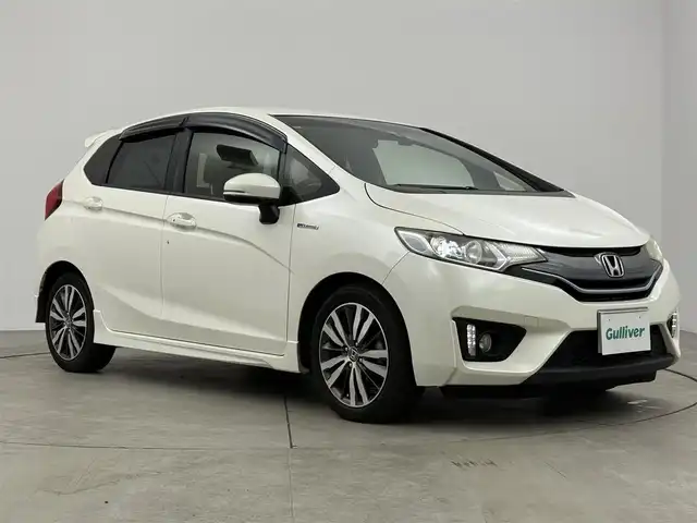 ホンダ フィット ハイブリット Sパッケージ 愛知県 2013(平25)年 5.5万km パール 純正ナビ/バックカメラ/衝突軽減ブレーキ/クルーズコントロール/純正16インチアルミホイール/ワンセグTV/ドライブレコーダー/Bluetooth/CD/DVD再生/スマートキー/プッシュスタート/電動格納ミラー/ＥＴＣ