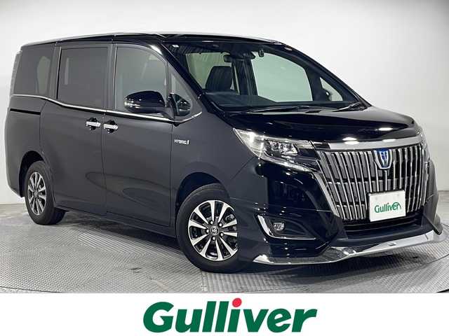 トヨタ エスクァイア ハイブリッド Gi 広島県 2020(令2)年 9万km ブラック 純正10型ナビ/純正フリップダウンモニター/モデリスタフロントエアロ/両側パワースライドドア/シートヒーター/黒革シート/バックカメラ/セーフティセンス/・プリクラッシュセーフティ/・レーンディパーチャーアラート/・オートマチックハイビーム/クルーズコントロール/クリアランスソナー/LEDヘッドランプ/オートライト/純正15インチAW/ETC/ドライブレコーダー