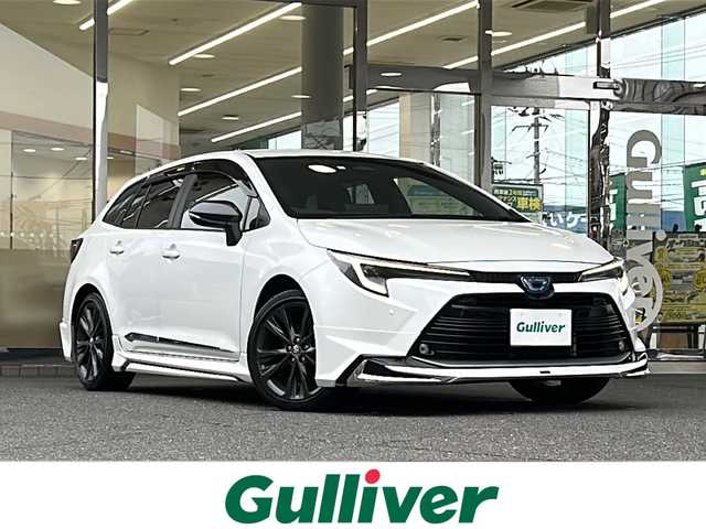 トヨタ カローラツーリング ハイブリッド ダブルバイビー 福島県 2023(令5)年 5.1万km プラチナホワイトパールマイカ 登録時走行距離：50/311km/ワンオーナー/純正SDナビ/（フルセグTV/BT接続/AM/FM）/ETC2.0/クルーズコントロール/モデリスタ（フルエアロ）/純正AW/電動Pブレーキ/ブレーキホールド/ハーフレザーシート/革巻きハンドル/オートライト/オートハイビーム/電格ミラー/ウィンカーミラー/純正フロアマット/横滑り防止装置/社外AWスタッドレスタイヤ×４/スペアキー/ドアバイザー/保証書/取扱説明書