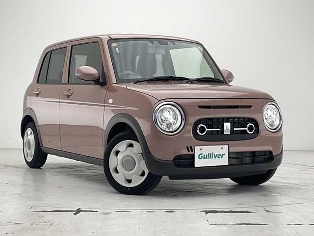 スズキ ラパン ＬＣ L 沖縄県 2023(令5)年 0.7万km テラコッタピンクメタリック 純正ディスプレイオーディオ/　（Bluetooth/USB/AM/FM）/バックカメラ/衝突被害軽減システム/コーナーセンサー/アイドリングストップ/ハーフレザーシート/シートヒーター/純正フロアマット/スマートキー/プッシュスタート/LEDヘッドライト/オートライト