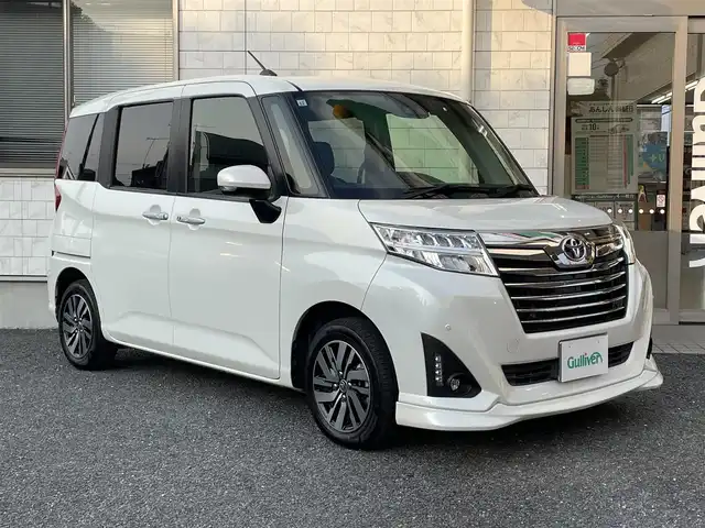 トヨタ ルーミー カスタムG 埼玉県 2019(令1)年 6.4万km パールホワイトⅢ 1オーナー/純正9インチナビ/フルセグ・CD・DVD・BT/Bカメラ/PCS/TRC/アイドリングストップ/クルコン(追従なし)/コーナーセンサー/シートヒーター(D/N席)/ETC/LEDヘッドライト/オートライト/オートハイビーム/フォグランプ/両側パワースライドドア/純正前ドラレコ/社外AW(165/65/R14・スタッドレス付き)/スマートキー2本/保証書/取扱説明書