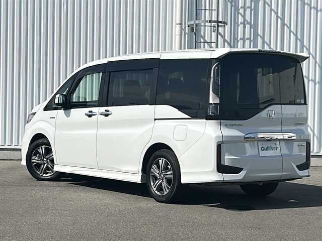 ホンダ ステップワゴン スパーダ ハイブリッド G EX ホンダセンシング 愛媛県 2019(平31)年 7.2万km プラチナホワイトパール 全方位カメラ/ホンダセンシング/フリップダウンモニター/両側パワースライドドア/純正10インチナビ/フルセグTV/ビルトインETC/ドライブレコーダー前後/オートライトLED/フォグランプ/ハーフレザー/シートヒーター/純正フロアマット/横滑り防止装置/レーンキープアシスト/ウォークスルー/クルーズコントロール/スマートキー/ABS