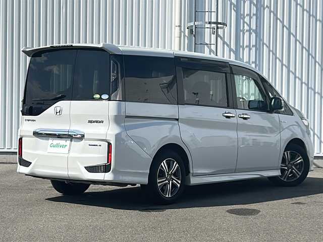 ホンダ ステップワゴン スパーダ ハイブリッド G EX ホンダセンシング 愛媛県 2019(平31)年 7.2万km プラチナホワイトパール 全方位カメラ/ホンダセンシング/フリップダウンモニター/両側パワースライドドア/純正10インチナビ/フルセグTV/ビルトインETC/ドライブレコーダー前後/オートライトLED/フォグランプ/ハーフレザー/シートヒーター/純正フロアマット/横滑り防止装置/レーンキープアシスト/ウォークスルー/クルーズコントロール/スマートキー/ABS