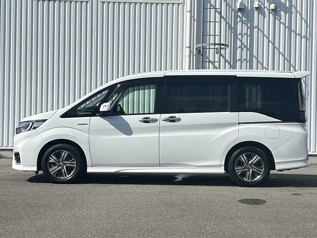 ホンダ ステップワゴン スパーダ ハイブリッド G EX ホンダセンシング 愛媛県 2019(平31)年 7.2万km プラチナホワイトパール 全方位カメラ/ホンダセンシング/フリップダウンモニター/両側パワースライドドア/純正10インチナビ/フルセグTV/ビルトインETC/ドライブレコーダー前後/オートライトLED/フォグランプ/ハーフレザー/シートヒーター/純正フロアマット/横滑り防止装置/レーンキープアシスト/ウォークスルー/クルーズコントロール/スマートキー/ABS