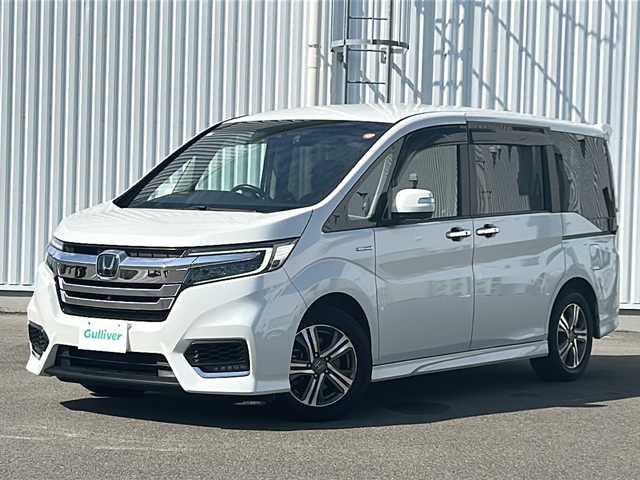 ホンダ ステップワゴン スパーダ ハイブリッド G EX ホンダセンシング 愛媛県 2019(平31)年 7.2万km プラチナホワイトパール 全方位カメラ/ホンダセンシング/フリップダウンモニター/両側パワースライドドア/純正10インチナビ/フルセグTV/ビルトインETC/ドライブレコーダー前後/オートライトLED/フォグランプ/ハーフレザー/シートヒーター/純正フロアマット/横滑り防止装置/レーンキープアシスト/ウォークスルー/クルーズコントロール/スマートキー/ABS