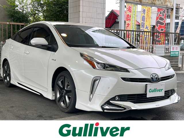 トヨタ プリウス A ツーリングセレクション 京都府 2020(令2)年 1.6万km ホワイトパールクリスタルシャイン モデリスタフルエアロ /ワンオーナー　/純正ディーラーＯＰＳＤナビ　/フルセグＴＶ　/革シート　/トヨタセーフティセンス　/バックカメラ　/前後コーナーセンサー　/LEDライト　/クルーズコントロール　/D席パワーシート/スマートキー/純正AW17インチ/前方純正ドライブレコーダー/ウィンカーミラー/アイドリングストップ/純正ビルトインETC/ワイヤレス充電/BSM/HUD