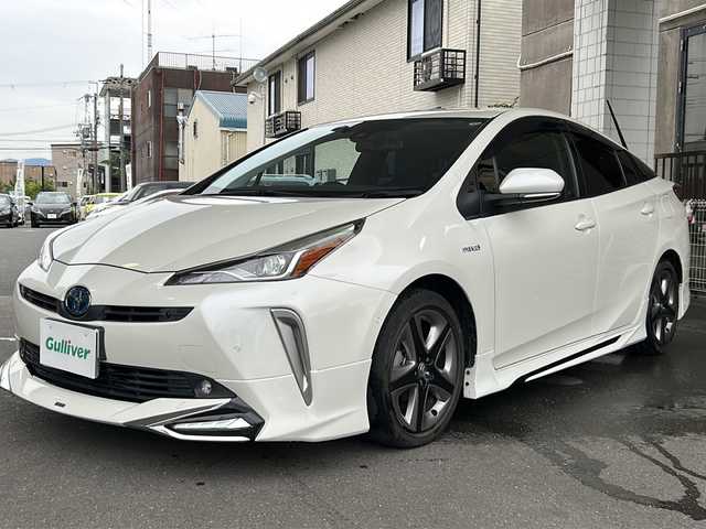 トヨタ プリウス A ツーリングセレクション 京都府 2020(令2)年 1.6万km ホワイトパールクリスタルシャイン モデリスタフルエアロ /ワンオーナー　/純正ディーラーＯＰＳＤナビ　/フルセグＴＶ　/革シート　/トヨタセーフティセンス　/バックカメラ　/前後コーナーセンサー　/LEDライト　/クルーズコントロール　/D席パワーシート/スマートキー/純正AW17インチ/前方純正ドライブレコーダー/ウィンカーミラー/アイドリングストップ/純正ビルトインETC/ワイヤレス充電/BSM/HUD