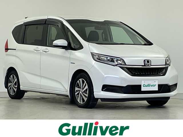 ホンダ フリード＋ ハイブリット G ホンダセンシング 岐阜県 2020(令2)年 7万km プラチナホワイトパール 純正SDナビ（VXM-204VFi)/フルセグ/DVD/BT/USB/バックカメラ/ホンダセンシング/・アダプティブクルーズコントロール/・誤発進抑制機能:/・車線維持支援システム/・後方誤発進抑制機能/・衝突被害軽減ブレーキ/パーキングセンサー/純正ドライブレコーダー/純正ビルトインETC/ハーフレザーシート/前席シートヒーター/両側パワースライドドア/純正フロアマット/サンシェード/純正15インチAW/寒冷地仕様/プッシュスタート/LEDオートライト