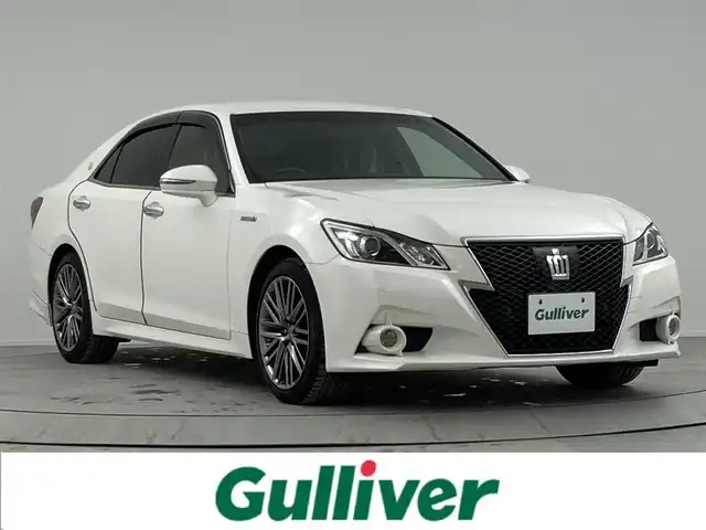 トヨタ クラウン ハイブリッド アスリートS 熊本県 2014(平26)年 7.1万km ホワイトパールクリスタルシャイン 純正ナビ（ＣＤ・ＤＶＤ・フルセグ・ＢＴ・ＨＤＤ・USB）/バックカメラ　/ビルトインＥＴＣ　/後ろのみコーナーセンサー　/レーダークルーズコントロール　/前席シートヒーター　/前席エアーシート　/前席パワーシート/ステアリングヒーター/プリクラッシュセーフティ/横滑り防止/パワーバックドア/ドアバイザー/純正フロアゴムマット/純正１８インチAW/オートライト/LEDヘッドライト/フォグライト/スマートキー/プッシュスタート/スペアキー1本/保証書/取扱説明書