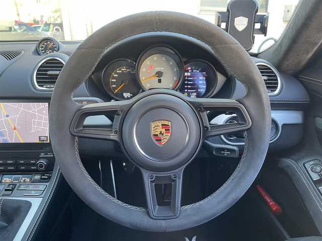ポルシェ ７１８ケイマン GT4 東京都 2021(令3)年 0.8万km 黒 ６速MT/ワンオーナー/純正ナビ/・BT/CD/DVD/SD/BT/ラジオ/リアビューカメラ/ビルトインETC2.0/LEDヘッドライト/オートエアコン/クロノパッケージ/シートヒーター/電動AOUT格納機能付ミラー/新車時保証書/取扱説明書
