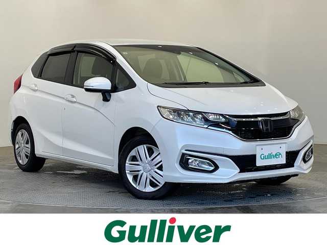 ホンダ フィット 13G L ホンダセンシング 栃木県 2019(令1)年 1.1万km プラチナホワイトパール 純正メモリナビ【VXM-194VFi】/（CD/DVD/フルセグTV/Bluetooth）/バックカメラ/ホンダセンシング/前方ドライブレコーダー/禁煙車/オートライト/LEDヘッドライト/横滑り防止装置/スマートキー/プッシュスタート/アイドリングストップ/電動格納ミラー/純正フロアマット/ドアバイザー