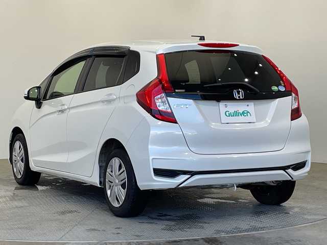 ホンダ フィット 13G L ホンダセンシング 栃木県 2019(令1)年 1.1万km プラチナホワイトパール 純正メモリナビ【VXM-194VFi】/（CD/DVD/フルセグTV/Bluetooth）/バックカメラ/ホンダセンシング/前方ドライブレコーダー/禁煙車/オートライト/LEDヘッドライト/横滑り防止装置/スマートキー/プッシュスタート/アイドリングストップ/電動格納ミラー/純正フロアマット/ドアバイザー
