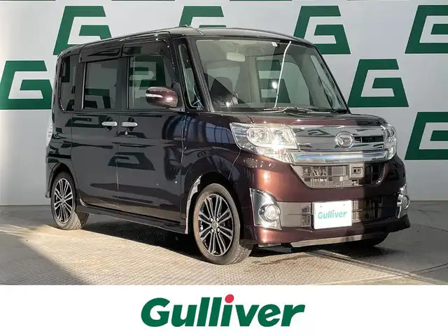 ダイハツ タント カスタム RS SA 鹿児島県 2015(平27)年 6.9万km プラムブラウンクリスタルマイカ ワンオーナー　/禁煙車　/純正８インチナビ（CD/DVD/Bluetooth/フルセグTV）/スマートアシスト　/バックカメラ　/両側パワースライドドア　/ＬＥＤヘッドライト　/横滑り防止機能　　/後席ロール式サンシェード　/ＥＴＣ　/オートライト/純正フロアマット/フォグランプ/純正アルミホイール