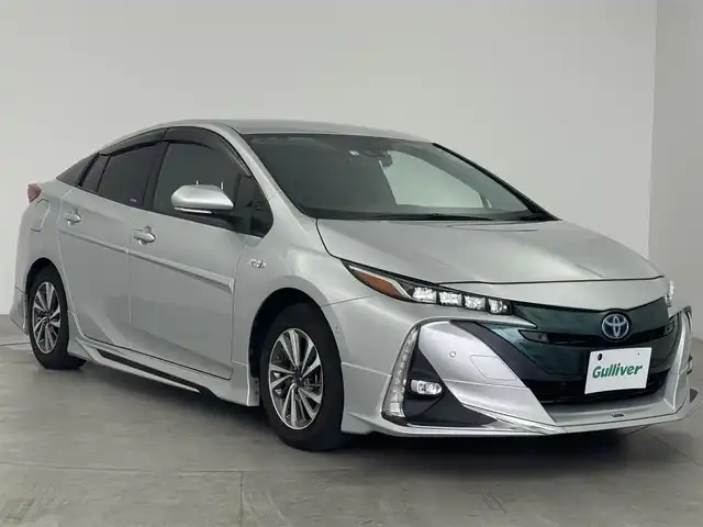 トヨタ プリウス ＰＨＶ Sナビパケ・セーフティプラス 愛知県 2018(平30)年 7.6万km シルバーM モデリスタフルエアロ/モデリスタアルミホイール/純正9インチナビ/・Bluetooth/フルセグTV/CD/DVD/バックカメラ/ビルドインETC/ドライブレコーダー/トヨタセーフティセンス/・衝突被害軽減システム/・レーンキープアシスト/・コーナーセンサー/・オートマチックハイビーム/レーダークルーズコントロール/・オートLEDヘッドライトライト/・LEDフォグランプ/シートヒーター/ステアリングヒーター/AC100V/プッシュスタート/・スマートキー