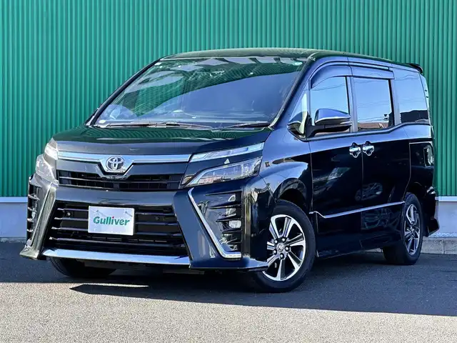 トヨタ ヴォクシー ZS 煌Ⅲ 宮城県 2021(令3)年 7.1万km イナズマスパーキングブラックガラスフレーク セーフティセンス/・プリクラッシュセーフティ/・レーンディパーチャーアラート/・オートマチックハイビーム/クリアランスソナー/パーキングサポートブレーキ/純正12インチフリップダウンモニター（V12T-R68C）/純正10インチナビ（NSZN-Z68T）/・CD/DVD/・Bluetooth/・フルセグTV/バックカメラ/ビルトインETC/両側電動スライドドア/ハーフレザーシート/革巻きステアリング/ステアリングスイッチ/LEDヘッドランプ/フォグランプ/オートライト/スマートキー＆プッシュスタート/電動格納ミラー/純正16インチAW/純正フロアマット/純正ドアバイザー/Wエアバッグ