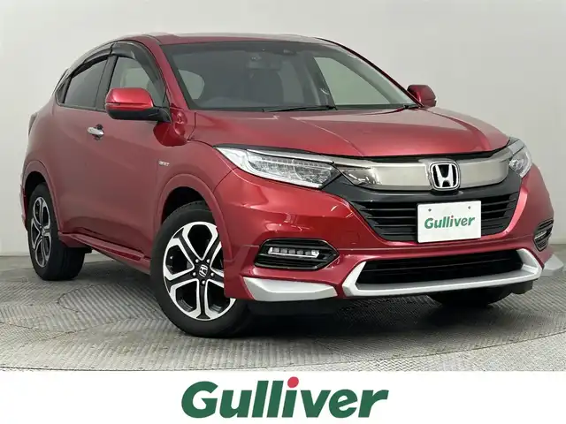 ホンダ ヴェゼル ハイブリッド Z ホンダセンシング 道央・札幌 2018(平30)年 7.9万km プレミアムクリスタルレッドM ・４WD/・寒冷地仕様/・純正メモリナビ/　BT／CD／DVD／SD／iPod／USB／フルセグ/・純正前方ドライブレコーダー/・純正ビルトインETC/・バックカメラ/・レーダークルーズコントロール/・衝突軽減ブレーキ/・レーンキープアシスト/・横滑り防止/・前席シートヒーター/・LEDヘッドライト/・オートライト/・プッシュスタート/・スマートキー×2/・純正エンジンスターター/・パドルシフト/・純正フロアマット/・純正サマー17インチAW/・社外スタッドレス積込（215／60／R16）/・取扱説明書