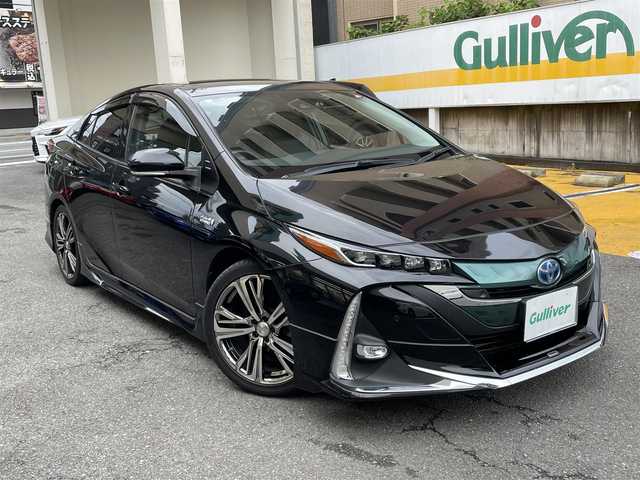トヨタ プリウス ＰＨＶ S セーフティプラス 静岡県 2018(平30)年 5.9万km アティチュードブラックマイカ ワンオーナー/モデリスタエアロ/純正9インチナビ/フルセグTV/DVD/CD/SD/MSV/BT/バックカメラ/黒革調シートカバー/プリクラッシュセーフティ/レーンキープアシスト/オートハイビーム/レーダークルーズコントロール/クリアランスソナー/前後ドライブレコーダー/ステアリングスイッチ/ステアリングヒーター/前席シートヒーター /社外18インチAW/LEDヘッドライト/LEDフォグライト/ビルトインETC/スマートキー×2/充電ケーブル有り/保証書/R5点検記録簿有