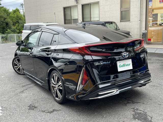 トヨタ プリウス ＰＨＶ S セーフティプラス 静岡県 2018(平30)年 5.9万km アティチュードブラックマイカ ワンオーナー/モデリスタエアロ/純正9インチナビ/フルセグTV/DVD/CD/SD/MSV/BT/バックカメラ/黒革調シートカバー/プリクラッシュセーフティ/レーンキープアシスト/オートハイビーム/レーダークルーズコントロール/クリアランスソナー/前後ドライブレコーダー/ステアリングスイッチ/ステアリングヒーター/前席シートヒーター /社外18インチAW/LEDヘッドライト/LEDフォグライト/ビルトインETC/スマートキー×2/充電ケーブル有り/保証書/R5点検記録簿有