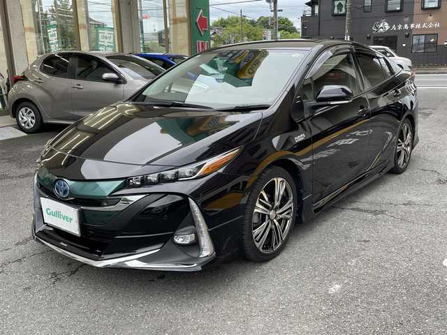 トヨタ プリウス ＰＨＶ S セーフティプラス 静岡県 2018(平30)年 5.9万km アティチュードブラックマイカ ワンオーナー/モデリスタエアロ/純正9インチナビ/フルセグTV/DVD/CD/SD/MSV/BT/バックカメラ/黒革調シートカバー/プリクラッシュセーフティ/レーンキープアシスト/オートハイビーム/レーダークルーズコントロール/クリアランスソナー/前後ドライブレコーダー/ステアリングスイッチ/ステアリングヒーター/前席シートヒーター /社外18インチAW/LEDヘッドライト/LEDフォグライト/ビルトインETC/スマートキー×2/充電ケーブル有り/保証書/R5点検記録簿有