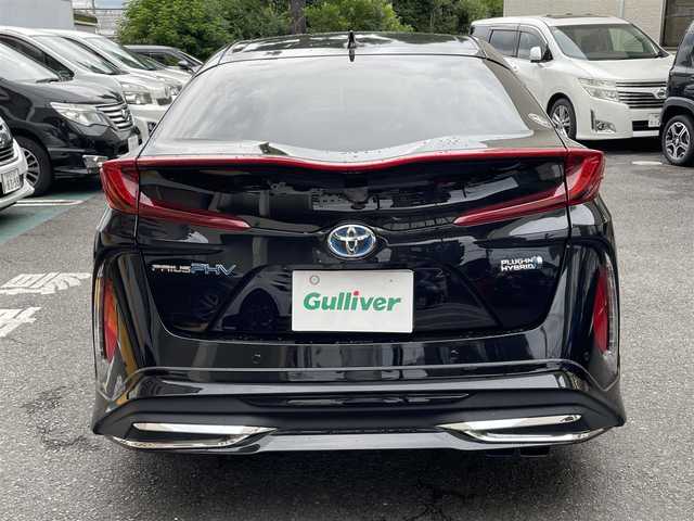 トヨタ プリウス ＰＨＶ S セーフティプラス 静岡県 2018(平30)年 5.9万km アティチュードブラックマイカ ワンオーナー/モデリスタエアロ/純正9インチナビ/フルセグTV/DVD/CD/SD/MSV/BT/バックカメラ/黒革調シートカバー/プリクラッシュセーフティ/レーンキープアシスト/オートハイビーム/レーダークルーズコントロール/クリアランスソナー/前後ドライブレコーダー/ステアリングスイッチ/ステアリングヒーター/前席シートヒーター /社外18インチAW/LEDヘッドライト/LEDフォグライト/ビルトインETC/スマートキー×2/充電ケーブル有り/保証書/R5点検記録簿有
