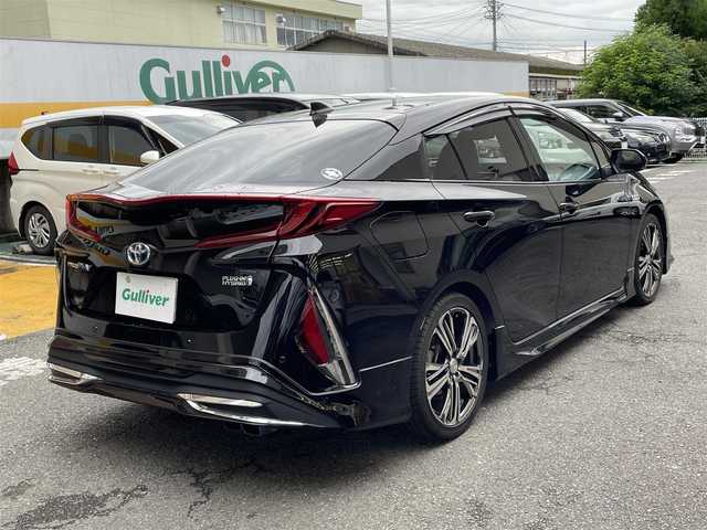 トヨタ プリウス ＰＨＶ S セーフティプラス 静岡県 2018(平30)年 5.9万km アティチュードブラックマイカ ワンオーナー/モデリスタエアロ/純正9インチナビ/フルセグTV/DVD/CD/SD/MSV/BT/バックカメラ/黒革調シートカバー/プリクラッシュセーフティ/レーンキープアシスト/オートハイビーム/レーダークルーズコントロール/クリアランスソナー/前後ドライブレコーダー/ステアリングスイッチ/ステアリングヒーター/前席シートヒーター /社外18インチAW/LEDヘッドライト/LEDフォグライト/ビルトインETC/スマートキー×2/充電ケーブル有り/保証書/R5点検記録簿有