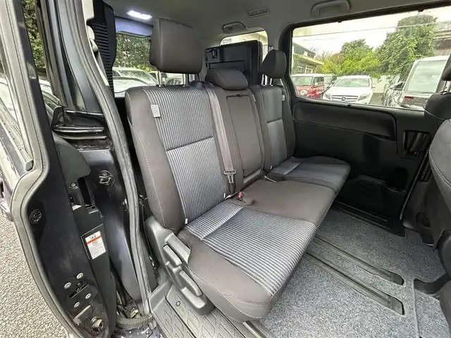 トヨタ ノア Si 東京都 2015(平27)年 4.2万km ダークバイオレットマイカメタリック ワンオーナー/純正9インチナビ/フルセグTV/DVD再生/bluetoothオーディオ/バックカメラ/両側パワースライドドア/純正ビルトインETC/前後ドライブレコーダー/LEDヘッドランプ/純正16インチAW/スマートキー×2/保証書/取扱説明書