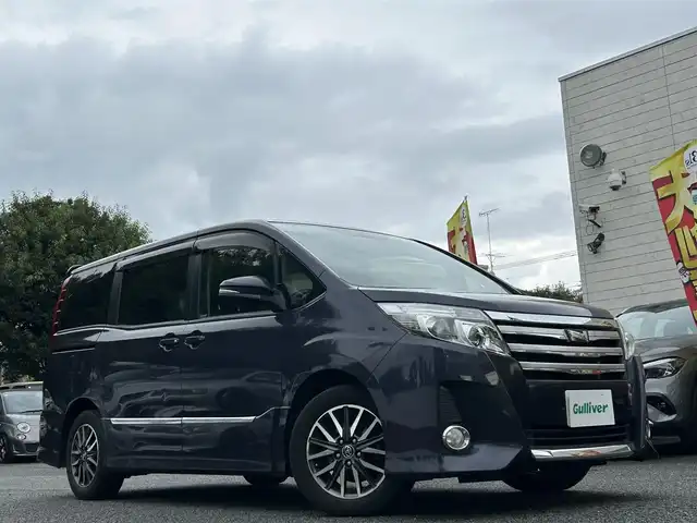 トヨタ ノア Si 東京都 2015(平27)年 4.2万km ダークバイオレットマイカメタリック ワンオーナー/純正9インチナビ/フルセグTV/DVD再生/bluetoothオーディオ/バックカメラ/両側パワースライドドア/純正ビルトインETC/前後ドライブレコーダー/LEDヘッドランプ/純正16インチAW/スマートキー×2/保証書/取扱説明書