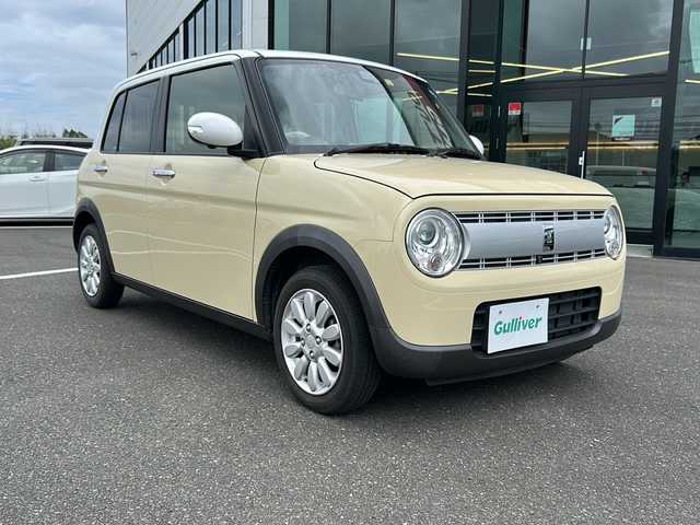スズキ ラパン X 鹿児島県 2022(令4)年 3.3万km シフォンアイボリーメタリック プッシュスタートボタン/社外ナビ/Panasonic（CN-RZ775W）/アイドリングストップ/シートヒーター/純正アルミホイール14インチ/社外オーディオ/Bluetooth/DVD/CD/オートライト/レーンアシスト/パーキングアシスト/ETC/フルセグ