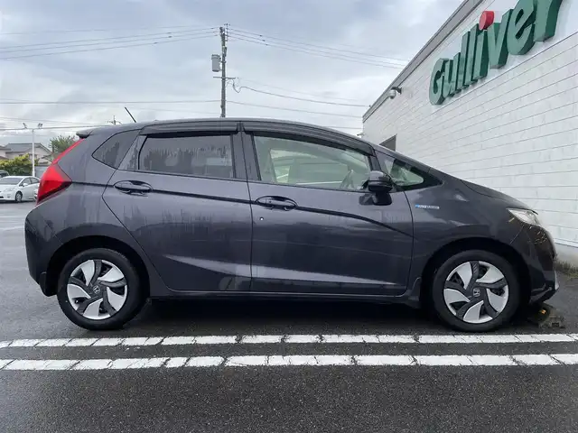 ホンダ フィット ハイブリット Fパッケージ 宮崎県 2015(平27)年 10.7万km ルーセブラックM ワンオーナー/プッシュスタート/スマートキー/純正オーディオ/・CD・USB・AM・FM/ETC/LEDヘッドライト/オートライト/純正フロアマット/純正ドアバイザー/電動格納ミラー