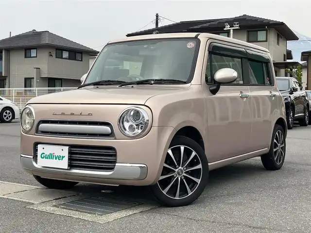 スズキ ラパン ショコラ X 静岡県 2013(平25)年 9.4万km シャンパンピンクPM エンジンスタートボタン/スマートキー/パワーステアリング/パワーウィンドウ/アイドリングストップ/オートエアコン/ETC/USB入力端子/ドライブレコーダー/ベンチシート/メモリナビ（CD.DVD.BT.ワンセグ）/純正フロアマット/ABS/盗難防止装置/オートライト/Wエアバック