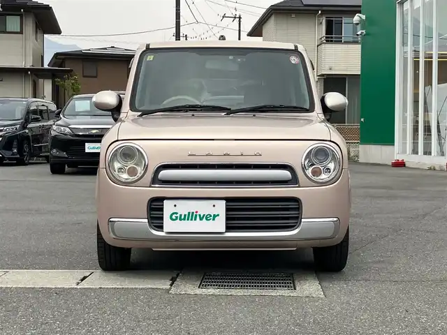 スズキ ラパン ショコラ X 静岡県 2013(平25)年 9.4万km シャンパンピンクPM エンジンスタートボタン/スマートキー/パワーステアリング/パワーウィンドウ/アイドリングストップ/オートエアコン/ETC/USB入力端子/ドライブレコーダー/ベンチシート/メモリナビ（CD.DVD.BT.ワンセグ）/純正フロアマット/ABS/盗難防止装置/オートライト/Wエアバック