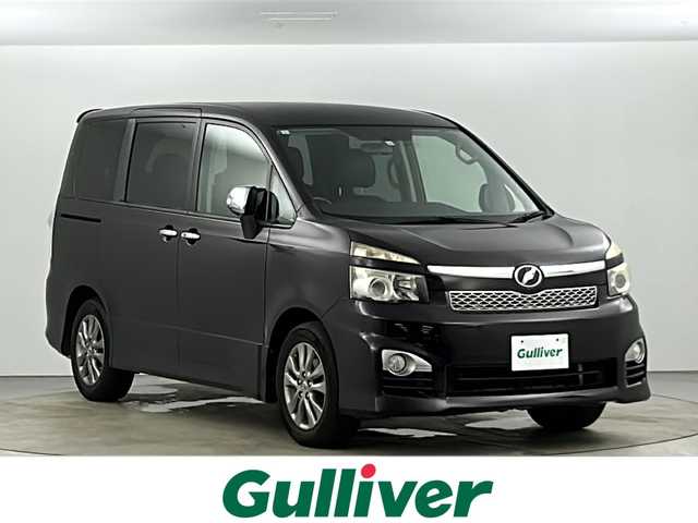 トヨタ ヴォクシー ZS 煌 愛知県 2011(平23)年 13.5万km ボルドーマイカメタリック メモリナビ/（AM/FM/CD/DVD/TV）/バックカメラ/フリップダウンモニター/ワンセグテレビ/パドルシフト/オートライト/ドアバイザー/プッシュスタート/スマートキー/純正フロアマット/レザーシートカバー付