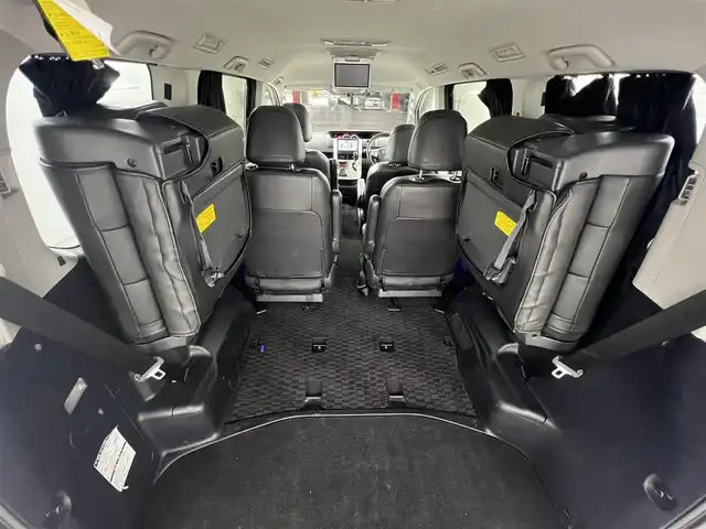 トヨタ ヴォクシー ZS 煌 愛知県 2011(平23)年 13.5万km ボルドーマイカメタリック メモリナビ/（AM/FM/CD/DVD/TV）/バックカメラ/フリップダウンモニター/ワンセグテレビ/パドルシフト/オートライト/ドアバイザー/プッシュスタート/スマートキー/純正フロアマット/レザーシートカバー付