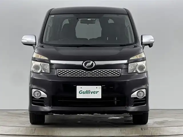 トヨタ ヴォクシー ZS 煌 愛知県 2011(平23)年 13.5万km ボルドーマイカメタリック メモリナビ/（AM/FM/CD/DVD/TV）/バックカメラ/フリップダウンモニター/ワンセグテレビ/パドルシフト/オートライト/ドアバイザー/プッシュスタート/スマートキー/純正フロアマット/レザーシートカバー付