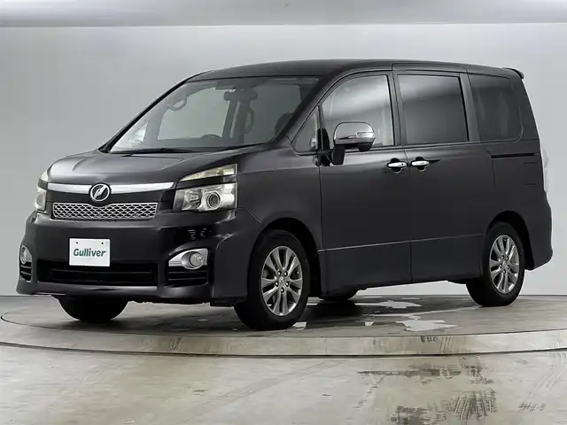 トヨタ ヴォクシー ZS 煌 愛知県 2011(平23)年 13.5万km ボルドーマイカメタリック メモリナビ/（AM/FM/CD/DVD/TV）/バックカメラ/フリップダウンモニター/ワンセグテレビ/パドルシフト/オートライト/ドアバイザー/プッシュスタート/スマートキー/純正フロアマット/レザーシートカバー付
