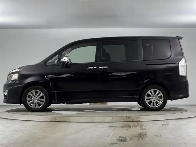 トヨタ ヴォクシー ZS 煌 愛知県 2011(平23)年 13.5万km ボルドーマイカメタリック メモリナビ/（AM/FM/CD/DVD/TV）/バックカメラ/フリップダウンモニター/ワンセグテレビ/パドルシフト/オートライト/ドアバイザー/プッシュスタート/スマートキー/純正フロアマット/レザーシートカバー付