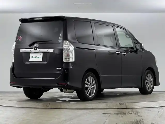 トヨタ ヴォクシー ZS 煌 愛知県 2011(平23)年 13.5万km ボルドーマイカメタリック メモリナビ/（AM/FM/CD/DVD/TV）/バックカメラ/フリップダウンモニター/ワンセグテレビ/パドルシフト/オートライト/ドアバイザー/プッシュスタート/スマートキー/純正フロアマット/レザーシートカバー付