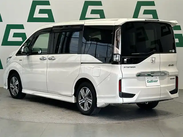 ホンダ ステップワゴン スパーダ ハイブリッド G ホンダセンシング 鹿児島県 2018(平30)年 5.9万km プラチナホワイトパール 禁煙　/純正９インチナビ　/純正フリップダウンモニター　/バックカメラ　/両側パワースライドドア　/ホンダセンシング　/追従型クルーズコントロール　/前方ドライブレコーダー　/ビルトインＥＴＣ　/ＬＥＤヘッドライト/オートライト/フロアマット/オートブレーキホールド/革巻きステアリング/ステアリングリモコン